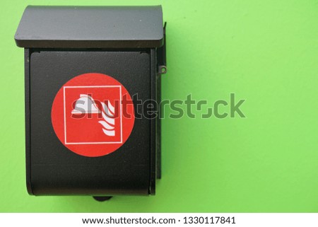 fire safety box on green wall