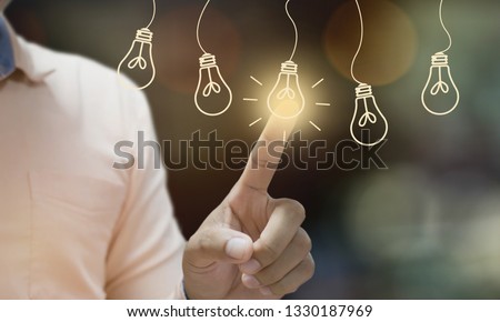 Businessman pressing light creative  idea Concept  idea and innovation