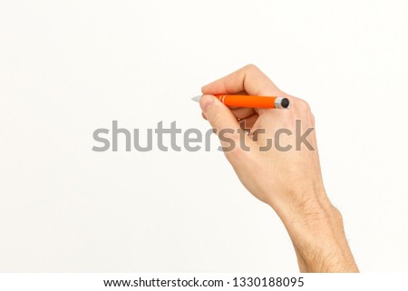writing hand. male hand hold black pen write on the wall isolated on white with clipping path 