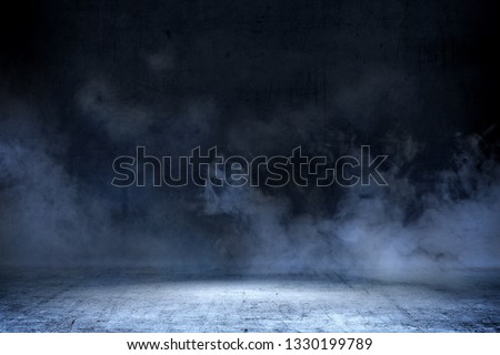 Room with concrete floor and smoke with dark wall background