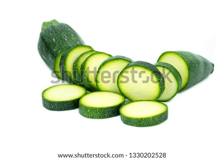 fresh green zucchini with slice isolated on white background 