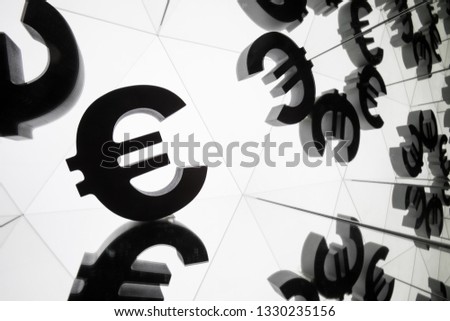 Euro Currency Symbol With Many Mirroring Images of Itself on White Background