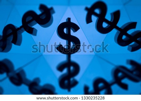 Dollar Currency Symbol With Many Mirroring Images of Itself on Blue Background