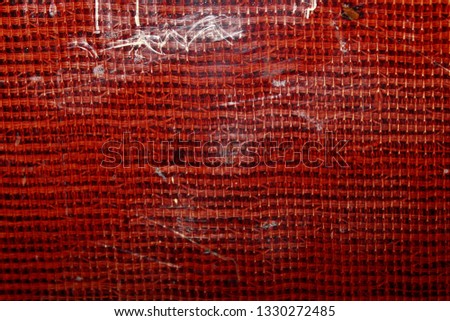 The fabric covered with a transparent varnish. Macro. Russia.