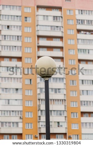 Street lamp on the background of a residential building.