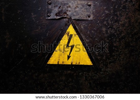 Sign Electrical Hazard on a dark background
