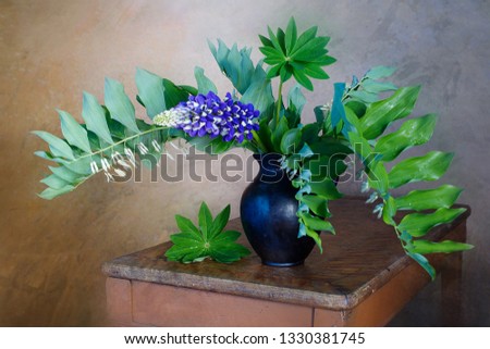Still life with beautiful purple lupines in a vase on a table on a brown background