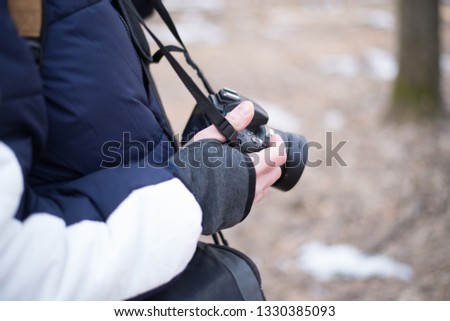 male photographer looks at the camera in the forest