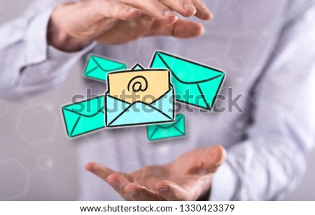 E-mail concept between hands of a man in background