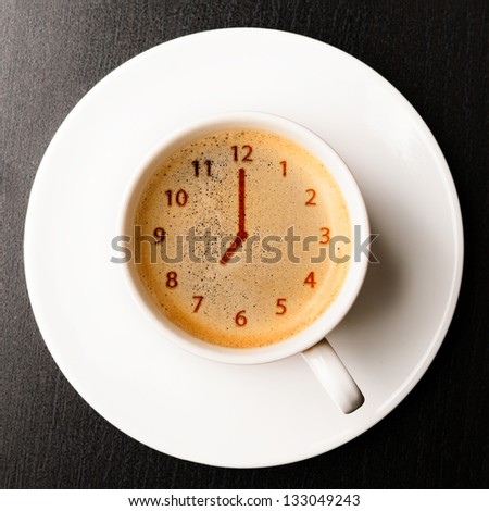 clock. cup of fresh espresso with clock sign, view from above Royalty-Free Stock Photo #133049243