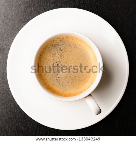 cup of fresh espresso on table, view from above Royalty-Free Stock Photo #133049249