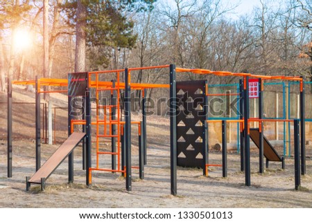 Street sports ground, outdoor gym at the forest with green pines, open air. Healthy lifestyle