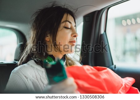 young beautiful woman in car portrait close-up