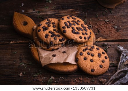 Choco cookies on rustic background Royalty-Free Stock Photo #1330509731