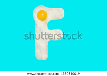 Fried egg in the shape of the letter F