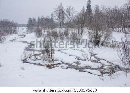a small river in winter is not frozen. winter landscape. snow picture. winter outside