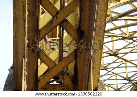 Close-up of a fragment of a yellow metal riveted beam. Zwierzyniecki Bridge is located in the eastern part of Wrocław, Poland