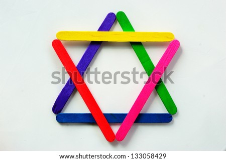 Colorful wood separated to the star symbol on isolated white