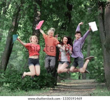 group of triumphant students have fun after passing the exam.photo with copy space