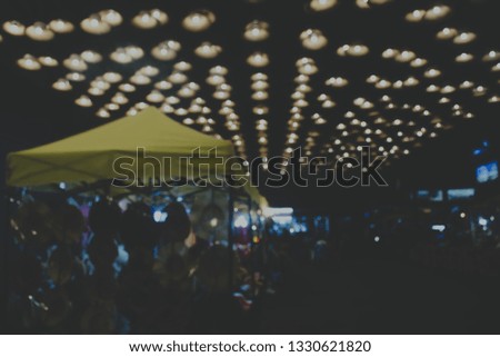 De focused/blur image of city at night.blurred urban abstract background.bokeh. 