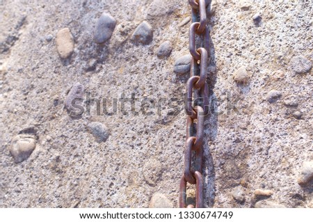 chain and stone wall