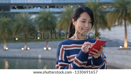 Woman use of mobile phone online