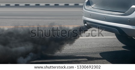 air pollution crisis in city from diesel vehicle exhaust pipe on road Royalty-Free Stock Photo #1330692302