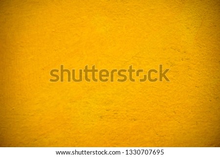 Distressed Grunge Yellow color texture. Empty damaged and scratchy painted background