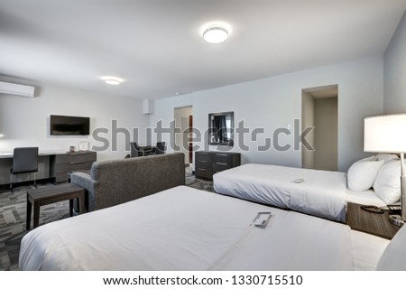 Hotel rooms and interiors with bathrooms and kitchenettes