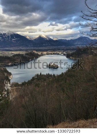 Top view on Bled Lake, Island, Catholic Church and Castle. Winter. Julian Alps in the background. Slovenia, Europe.