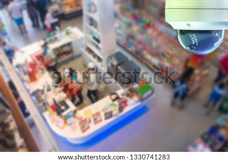A Dome CCTV  infrared camera  technology 4.0 for look security area of people at shop show signage with checking and counting people in cashier counter security area