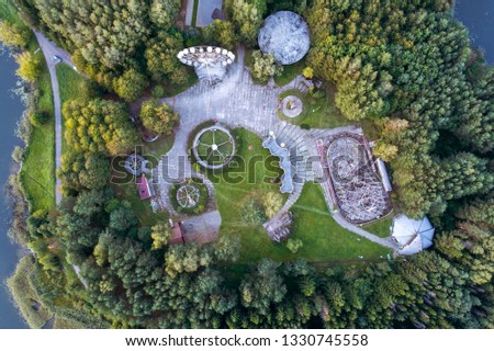 Top down aerial evening view of abandoned amusement park of Soviet era in Elektrenai, Lithuania Royalty-Free Stock Photo #1330745558