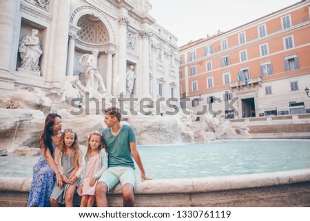 Family on vacation at Fontana di Trevi, Rome, Italy.