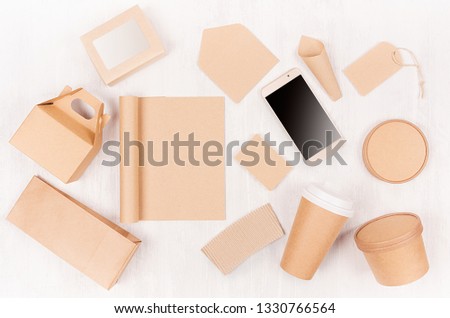 Food takeaway set mockup for brand - different container and box of kraft paper for asian cuisine, blank screen phone, bag, notepad, cup on white wood board.