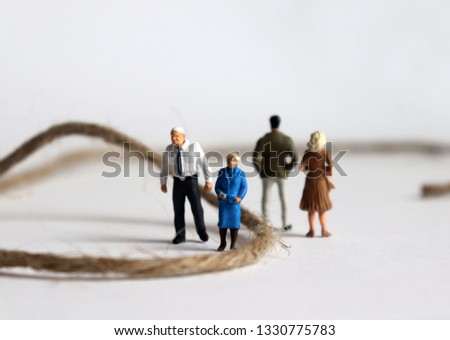 Miniature people. The concept of conflict between parents and children. Royalty-Free Stock Photo #1330775783