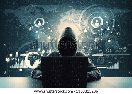 Hacker using laptop with abstract business interface at desktop with binary code. Technology and malware concept. Double exposure 