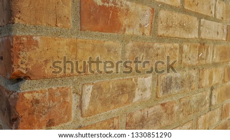 The walls were built from brown bricks, lined with plaster.