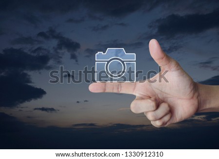 Camera flat icon on finger over sunset sky, Business camera service online concept