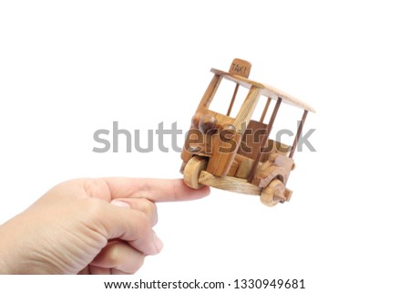 Wooden Tuk Tuk -  Thailand taxi model for souvenir and Decoration. Three-Wheels photo on isolated white background.
