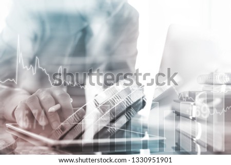 Business strategy analysis, financial investment concept. Double exposure of businessman working with digital tablet computer, analyzing stock market and financial graph for business background