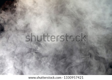 smoke blowing from exploration on dark background