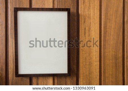 Empty Frame on wooden wall, background texture, with space for text, close-up