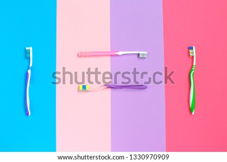 Set of different toothbrushes on color background. Top view. Hygiene of the oral cavity. Top viev.