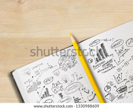 Open Notebook on wooden desk with icon relate with Digital Marketing, Business concept.