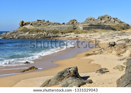 Beach and prehistoric settlement ruins. Castro de Baroña, Coruña, Spain.