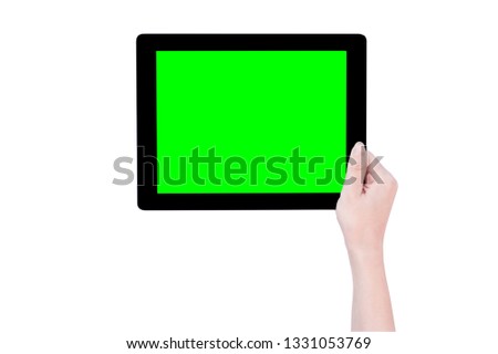 Teenage beautiful girl holding a black tablet pc template with green screen isolated on white background, close up, mock up, clipping path, cut out