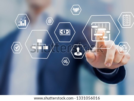 Project management tools and skills concept with professional manager touching icons of planning, schedule, organization of work, quality, risks, budget