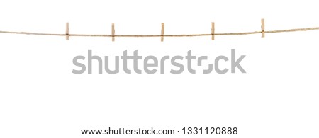 Clothespins on Clothesline Isolated Royalty-Free Stock Photo #1331120888