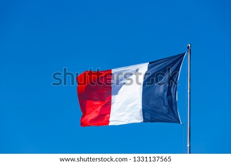 French Flag in blue Sky