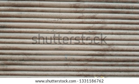 Parallel lines on a brown wood board